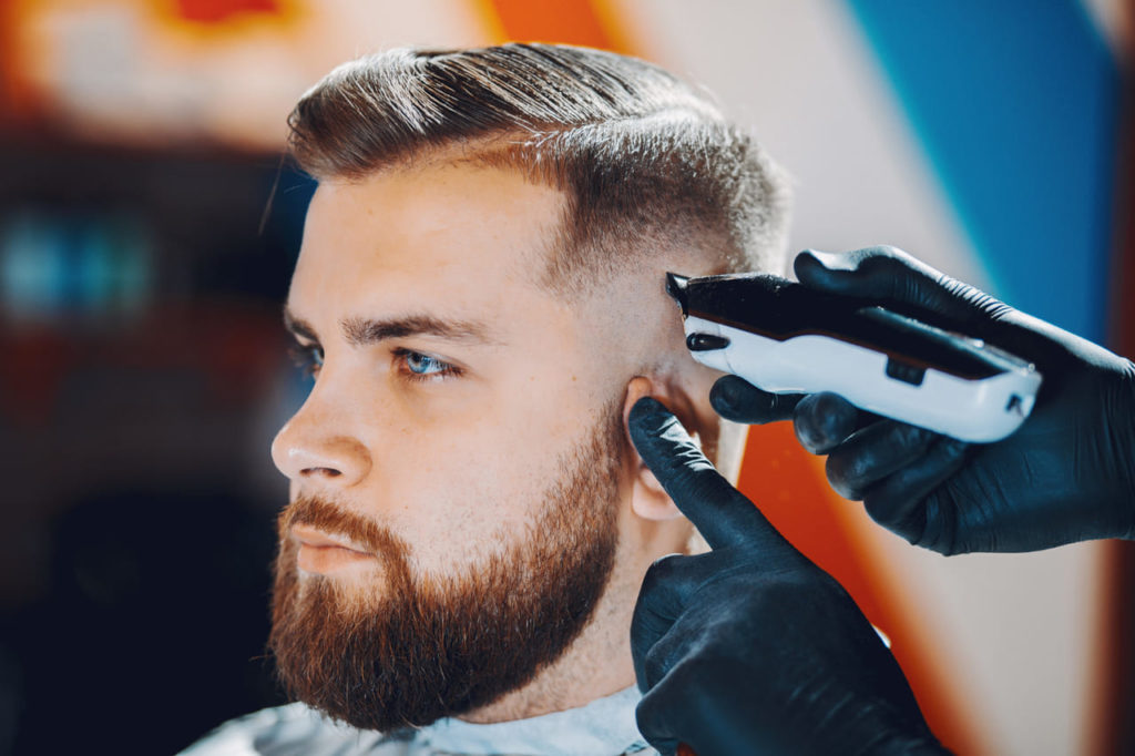 stylish-man-sitting-in-a-barbershop.jpg